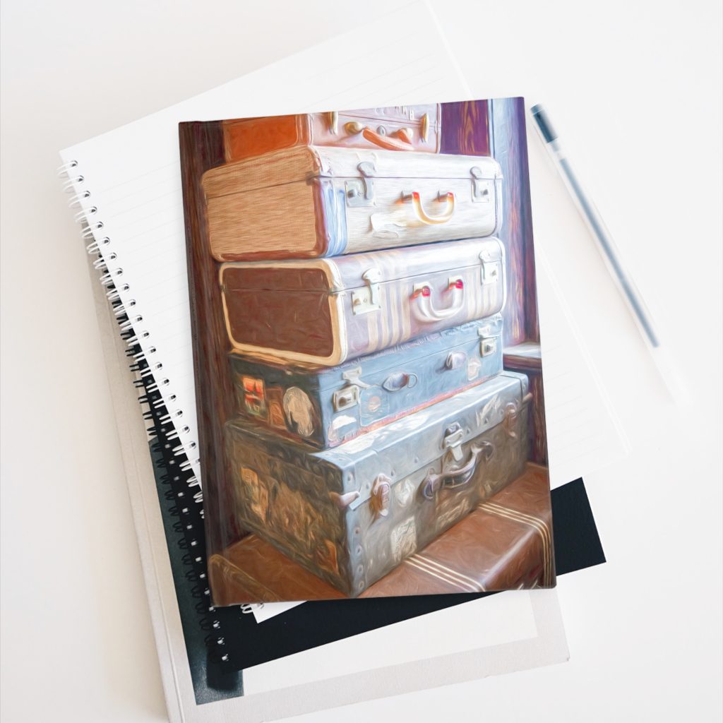 vintage suitcases hardcover journal on stack of books