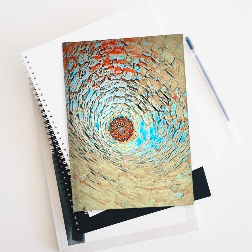 Stone Abyss hardcover journal on stack of books