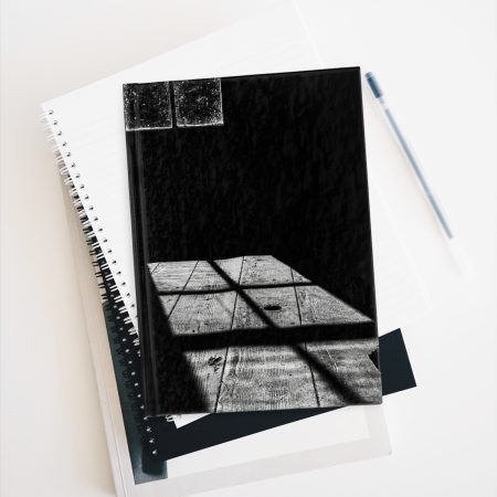 Cabin Window hardcover journal on stack of books